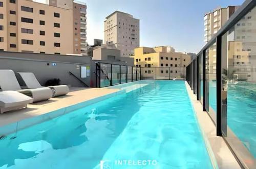 a large swimming pool on top of a building at Royal Luxury 305 in Poços de Caldas