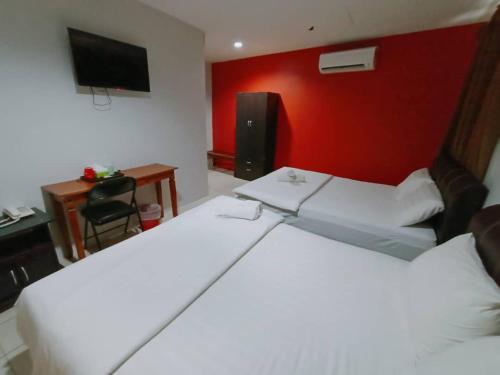 Katil atau katil-katil dalam bilik di Reintree Lodge Hotel Ipoh
