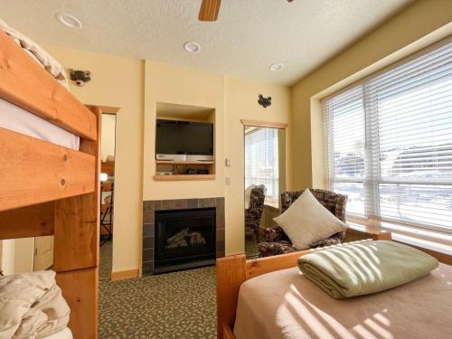 a bedroom with a bunk bed and a fireplace at 1BR 1BA for 5 Close to Outdoor Activities in Brian Head