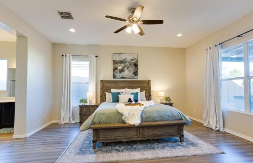 a bedroom with a bed and a ceiling fan at Creekside Queen Creek in Queen Creek
