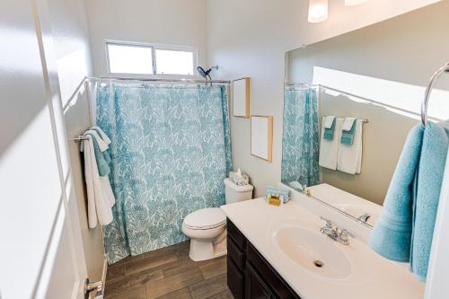 a bathroom with a sink and a toilet and a shower at Creekside Queen Creek in Queen Creek