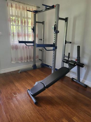 a gym with two tread machines in a room at Piton Star Villa in Choiseul