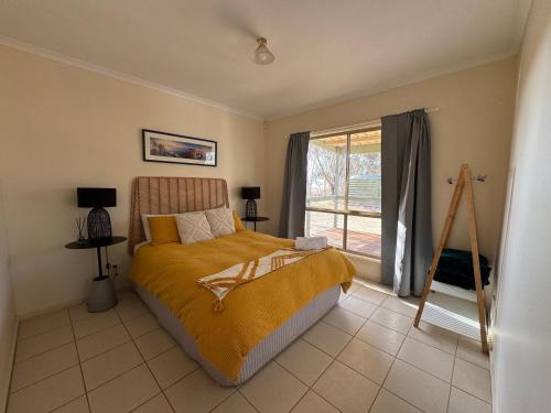 Ένα ή περισσότερα κρεβάτια σε δωμάτιο στο Allusion Farmstay and Vineyard Units