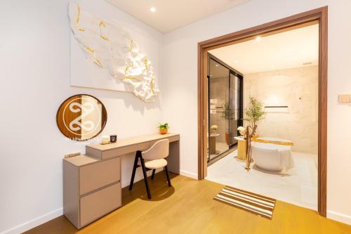 a bathroom with a desk and a shower at THE METROPOLE Apartment Complex OPERA-GALLERIA-CREST in Ho Chi Minh City
