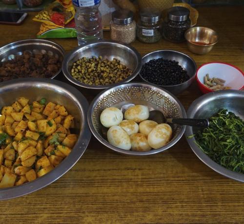 a group of bowls of food on a table at Jhigu Homestay Patan in Kathmandu