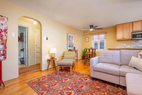 a living room with a couch and a table at Casita Gomez- Courtyard - Quiet - Railyard - 1BR in Santa Fe