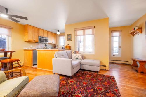 a living room with a couch and a table at Casita Gomez- Courtyard - Quiet - Railyard - 1BR in Santa Fe