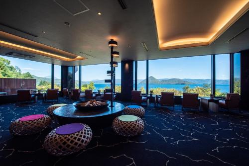 a hotel lobby with a view of the water at Hotel Premium Lake TOYA in Lake Toya