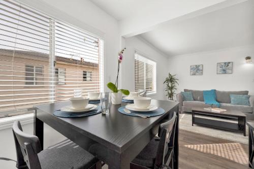 a dining room with a table and a couch at Cozy, Luxurious, Oasis, With Free parking in Los Angeles