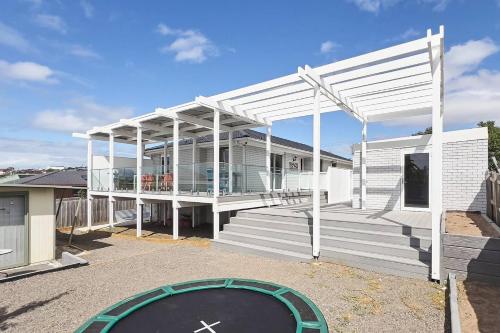 a large white building with a ramp in front of it at Bellarine Bungalow - Bay Breezes & Wineries Galore in Portarlington