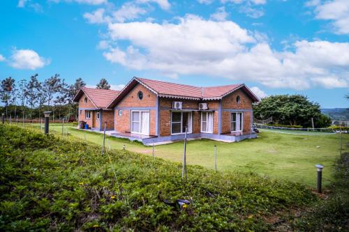 Κήπος έξω από το SaffronStays Amodhini Farmstay