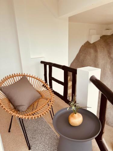 a room with a chair and a table and a chair at Top Notch View Villa in Koh Tao