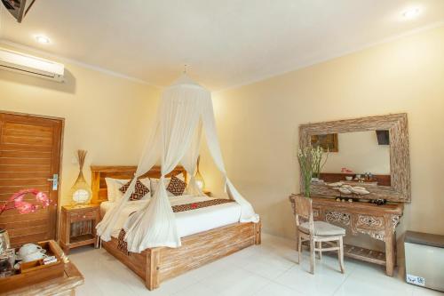Postel nebo postele na pokoji v ubytování Abhirama Villas and Spa