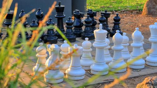 a chess set on a table in a garden at Yarrawonga Riverlands Tourist Park in Yarrawonga