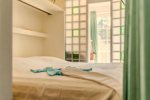 Ένα ή περισσότερα κρεβάτια σε δωμάτιο στο Achtern Diek Haus 12a Wohnung 3