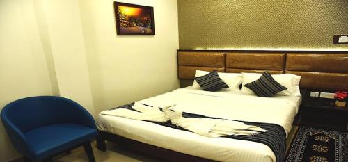 Ένα ή περισσότερα κρεβάτια σε δωμάτιο στο EMPIRE INN HOTEL