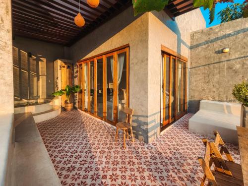 a bathroom with a tile floor and a tub at Proud Phu Fah Maerim Resort in Mae Rim