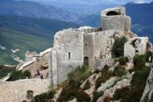 a stone building on top of a mountain at Etape Cathare in Duilhac