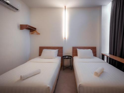 Postel nebo postele na pokoji v ubytování T+ PREMIUM HOTEL