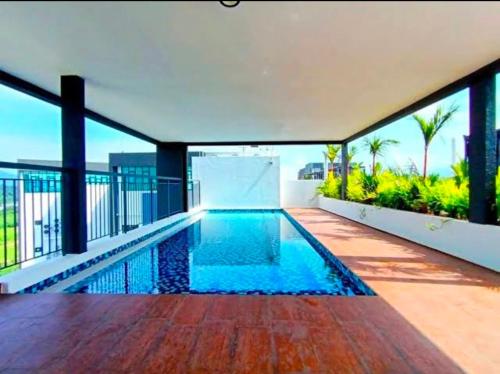 an indoor swimming pool in a house at The Horizon - Ipoh' Rachel in Ipoh