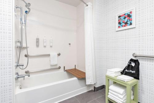 a white bathroom with a tub and a sink at Hampton Inn and Suites Lake Jackson-Clute in Clute