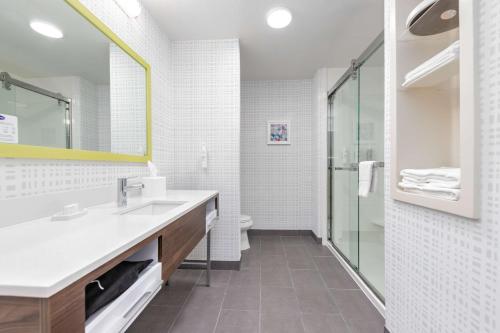 a bathroom with a sink and a shower and a toilet at Hampton Inn and Suites Lake Jackson-Clute in Clute
