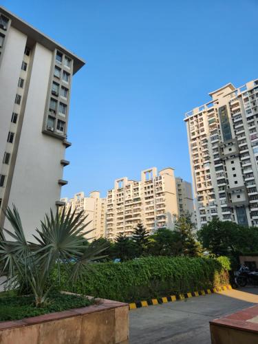 a group of tall buildings in a city at Executive studio appartment in Ghaziabad