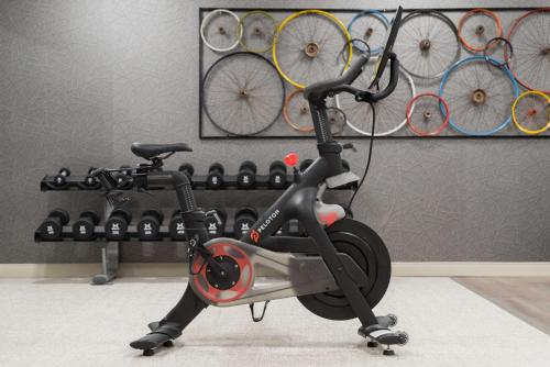 a scooter is parked in a room with bikes at Homewood Suites by Hilton Gateway Hills Nashua in Nashua