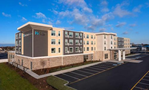 a building with a parking lot in front of it at Hyatt House Lewes Rehoboth Beach in Lewes