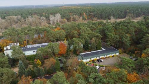 an aerial view of a building in the woods at Leśny Ośrodek Szkoleniowy w Puszczykowie in Puszczykowo