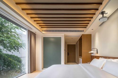 صورة لـ Mochi Luxury River View Resort Hotel (Yangshuo Xingping Ancient Town Lijiang Branch) في يانغتشو