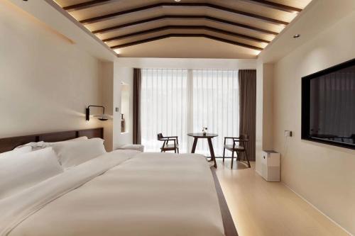 صورة لـ Mochi Luxury River View Resort Hotel (Yangshuo Xingping Ancient Town Lijiang Branch) في يانغتشو