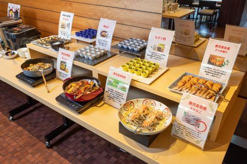 a table filled with different types of food at Sun Days Kagoshima in Kagoshima