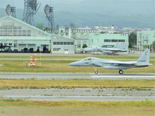 a fighter jet taking off from an airport runway at Hotel Airport Komatsu in Komatsu