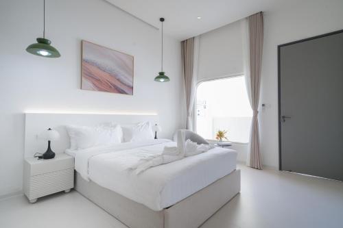 Ένα ή περισσότερα κρεβάτια σε δωμάτιο στο Pattaya Interstellar Village Resort House