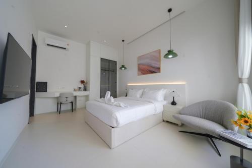Ένα ή περισσότερα κρεβάτια σε δωμάτιο στο Pattaya Interstellar Village Resort House