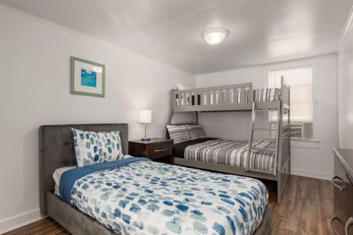 a bedroom with a bed and a bunk bed at Somerset 4 in Ocean City