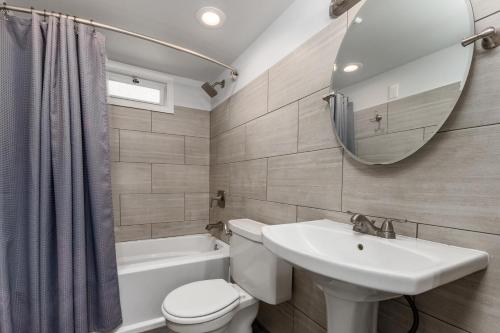 a bathroom with a sink toilet and a mirror at Somerset 4 in Ocean City