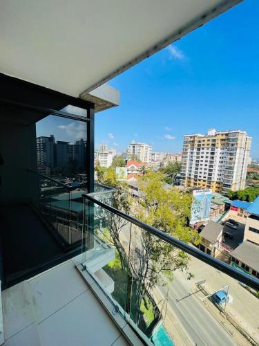 a view of a city from the balcony of a building at Silverstone Apartments Nairobi, Kilimani in Nairobi