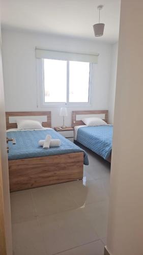 Una cama o camas en una habitación de Obv 3206