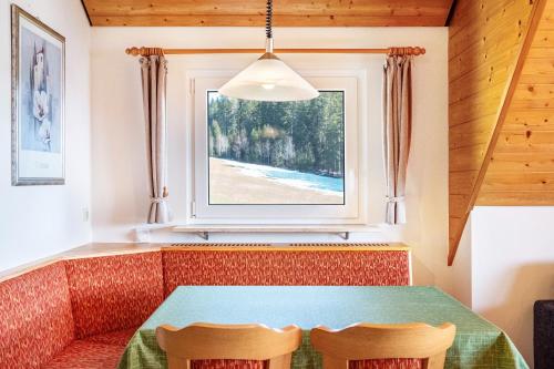 a dining room with a table and two chairs at Lorenzenhäusle Titisee-Neustadt in Titisee-Neustadt