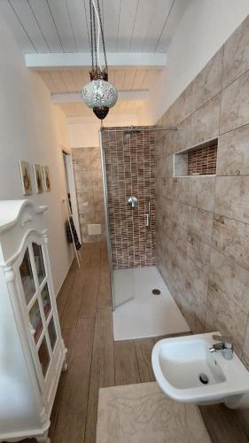 a bathroom with a shower and a sink at Casa Riad in Lesmo