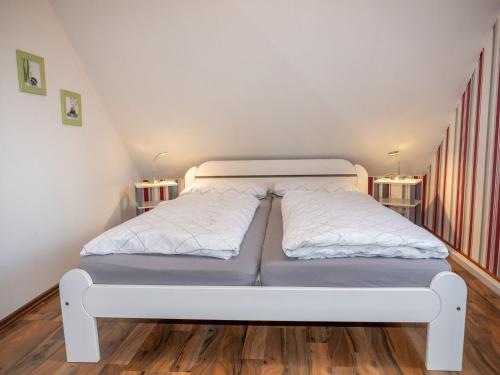 Postel nebo postele na pokoji v ubytování As bi uns to Huus