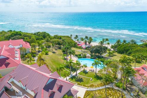 an aerial view of a resort and the ocean at Village Pierre & Vacances Sainte Anne in Sainte-Anne