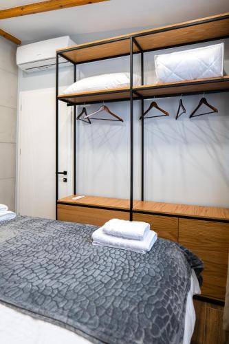 a bedroom with two bunk beds in a boat at AL Apartments Tirana in Tirana
