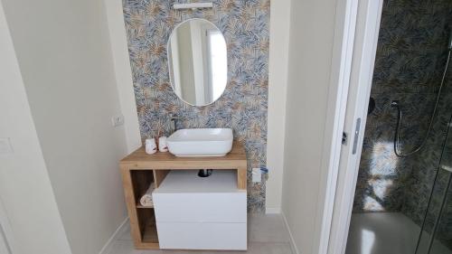 a bathroom with a sink and a mirror at VerdeLago in Como