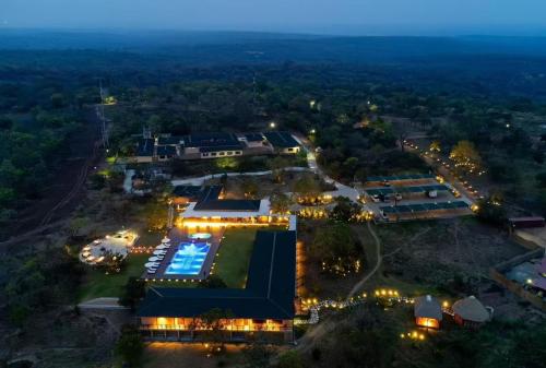 an aerial view of a resort at night at Entikko Safari Lodge in Fajao