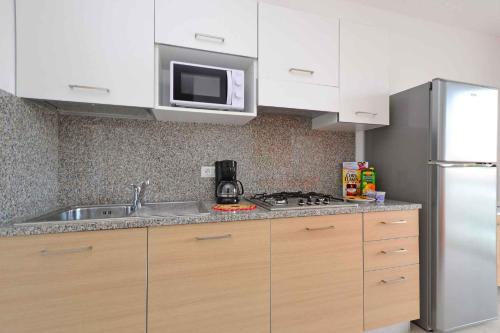 Η κουζίνα ή μικρή κουζίνα στο Apartments in Lignano 21656