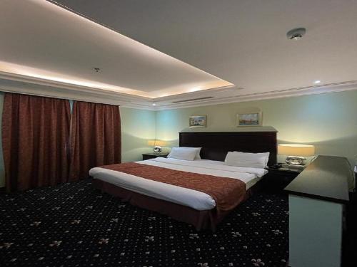Postel nebo postele na pokoji v ubytování Tourist Hotel