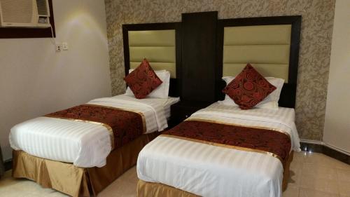 Voodi või voodid majutusasutuse Mkani Apartment toas